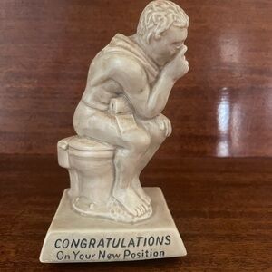 “Congratulations on your new position” vintage figurine.
